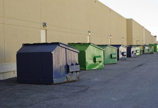 a pack of different construction bins lined up for service in Abington, MA